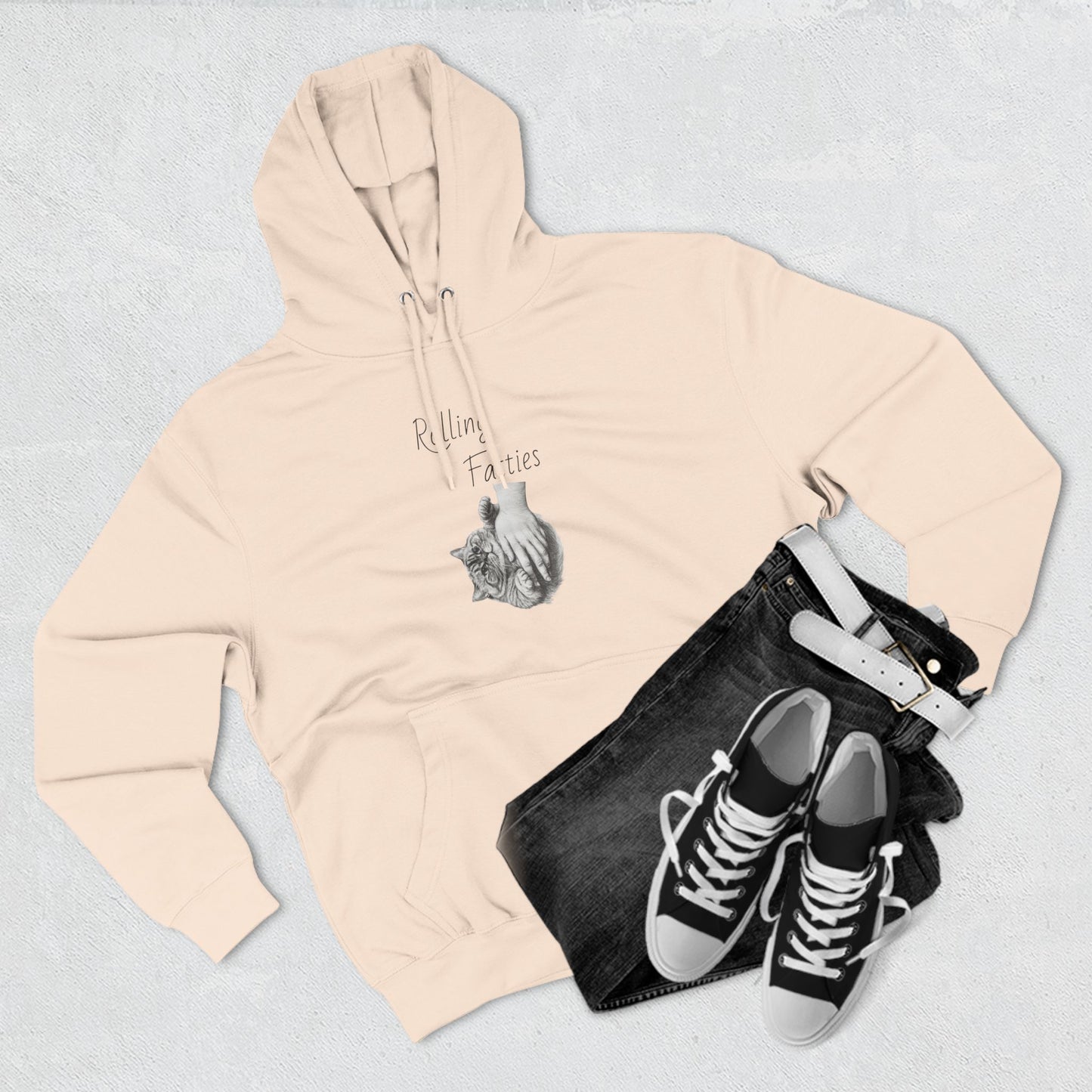 Beige Rolling Fatties Hoodie styled with black jeans and sneakers. A warm and stylish choice for casual outings.