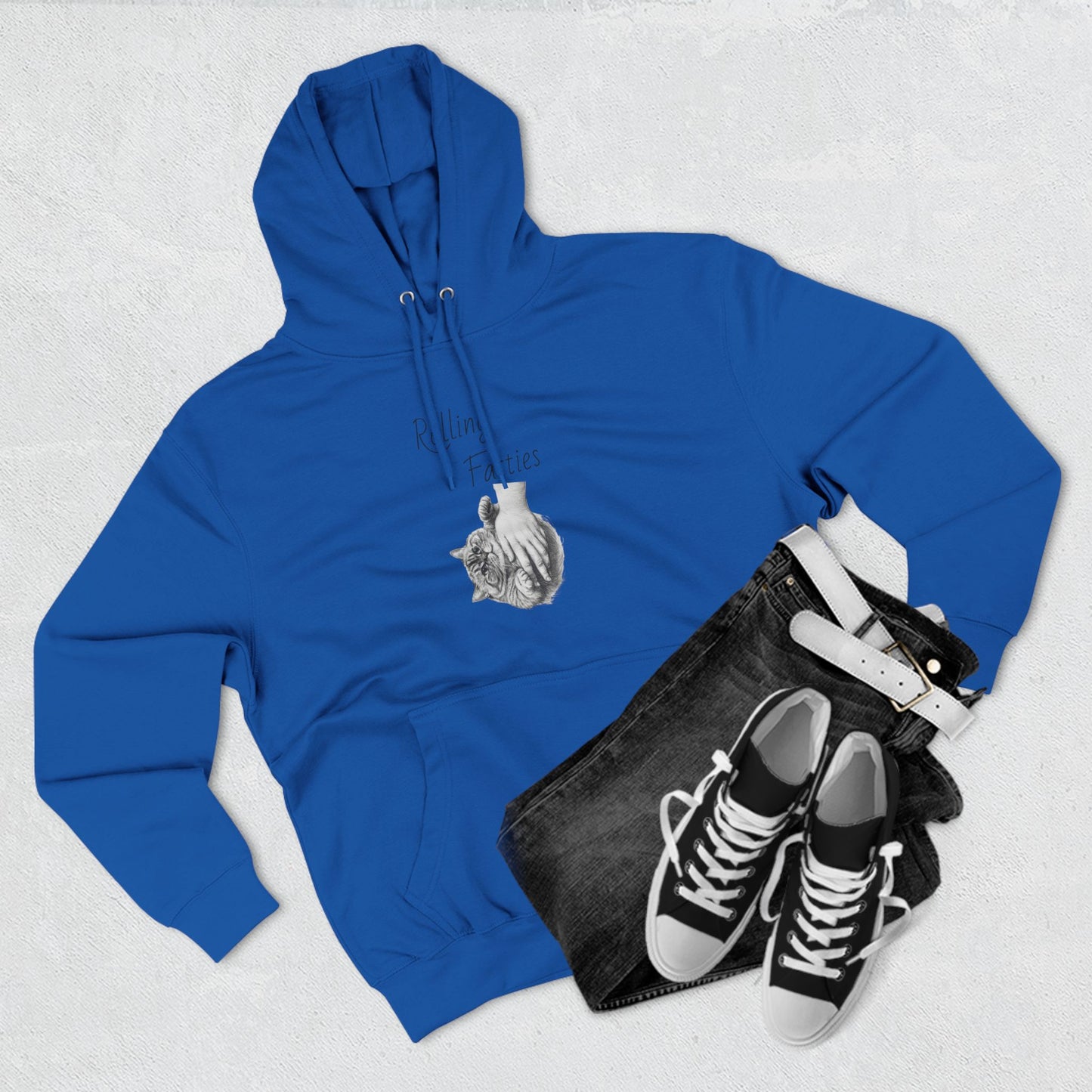 Royal blue Rolling Fatties Hoodie styled with black jeans and sneakers. A bold and comfortable outfit for casual wear.